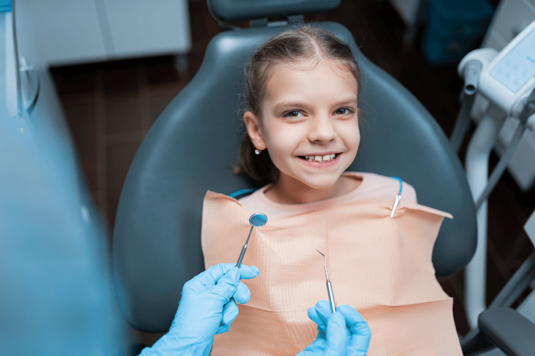 child smiling at dental checkup bethesda