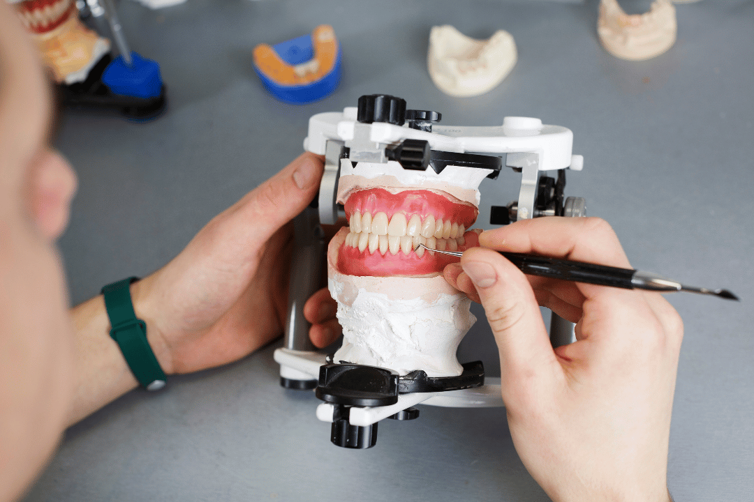 dental technician creating a porcelain crown bethesda