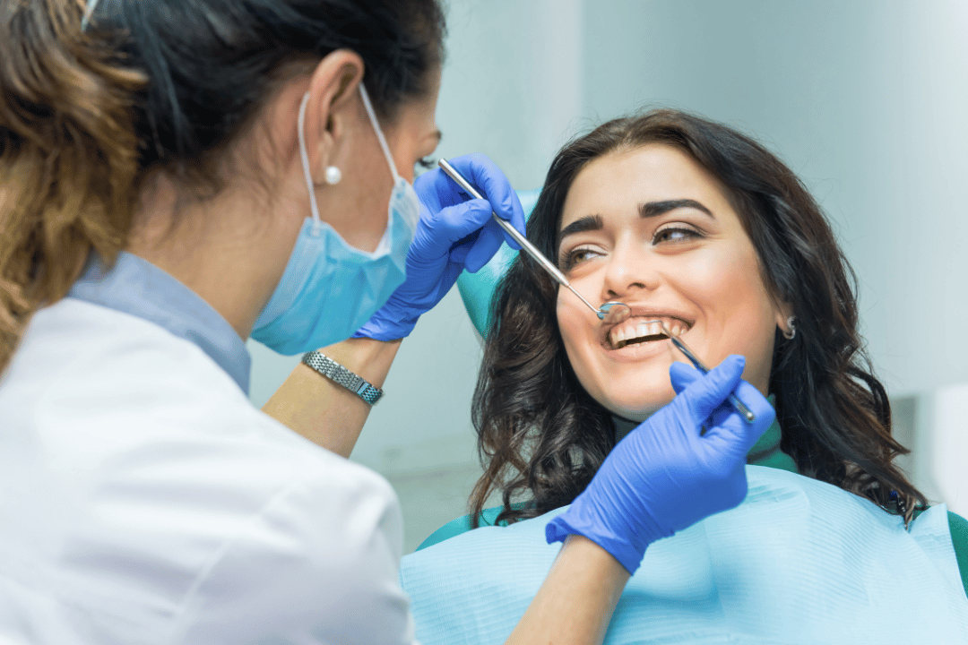 smiling patient in dentist chair bethesda 